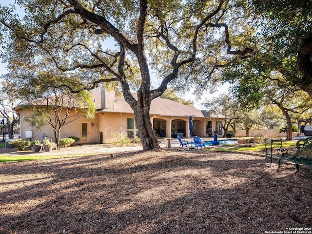 back of house featuring a patio