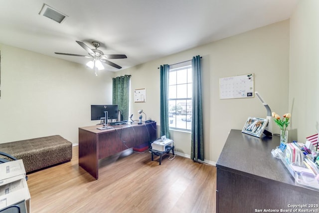 office with ceiling fan and light hardwood / wood-style floors