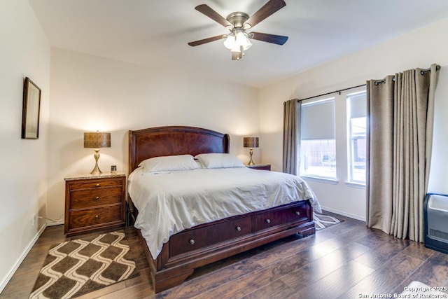 bedroom featuring ceiling fan and dark hardwood / wood-style floors