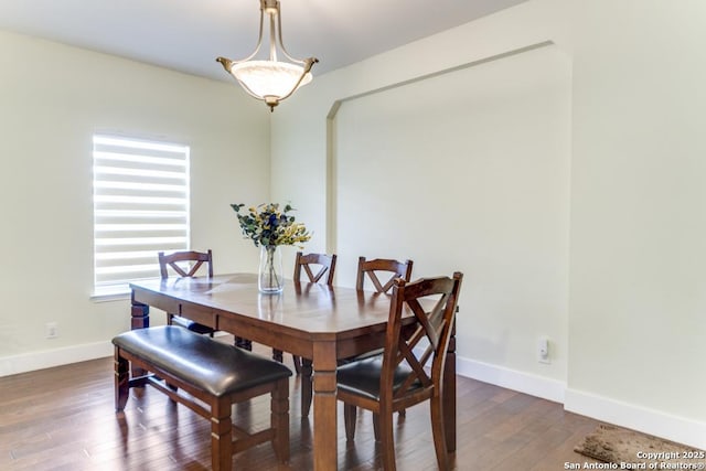 dining space featuring dark hardwood / wood-style flooring