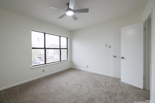 carpeted empty room with ceiling fan