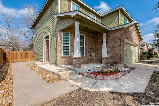 exterior space featuring a garage and a porch