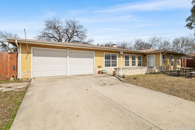 single story home with stone siding, fence, driveway, and stucco siding