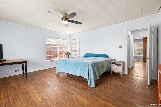 bedroom with wood-type flooring, baseboards, ceiling fan, and crown molding