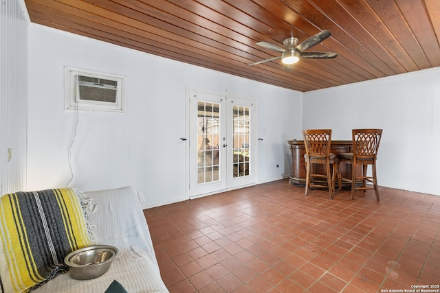 dining space with french doors, a dry bar, a wall mounted AC, a ceiling fan, and wooden ceiling