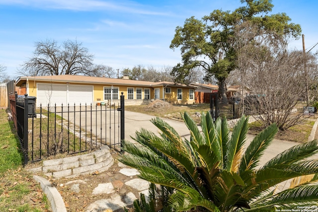 ranch-style home with a garage, concrete driveway, fence, and stucco siding