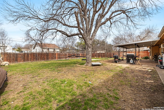 view of yard with a fenced backyard and a patio