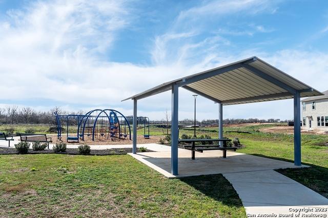 view of playground featuring a lawn