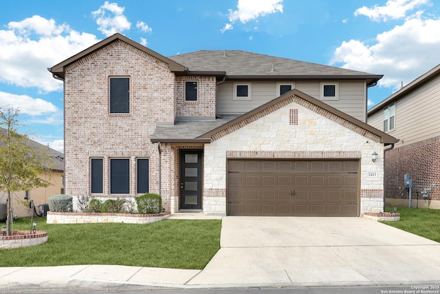 view of property with a garage and a front yard