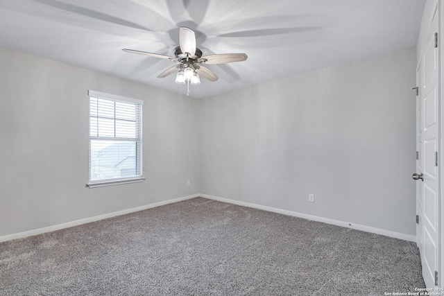 empty room with ceiling fan and carpet