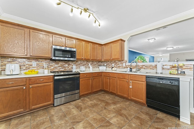 kitchen featuring ornamental molding, stainless steel appliances, sink, and backsplash