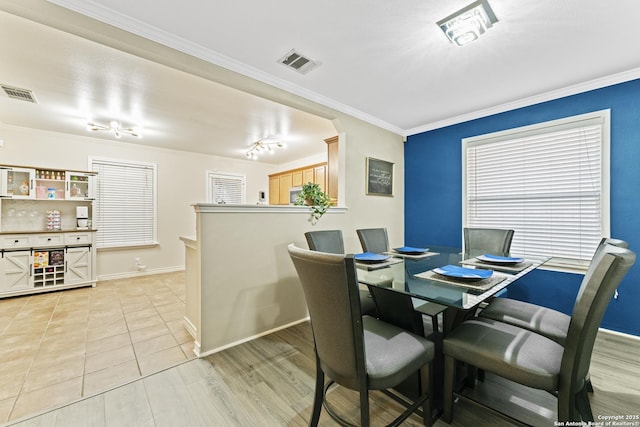 tiled dining area with ornamental molding