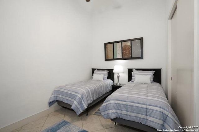 bedroom featuring light tile patterned floors