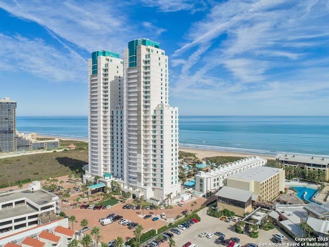 aerial view with a water view and a view of the beach