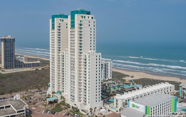 bird's eye view with a view of the beach and a water view