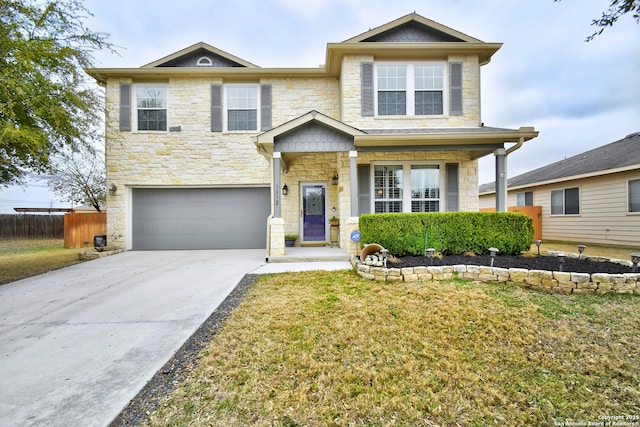 view of front of home featuring a garage and a front lawn