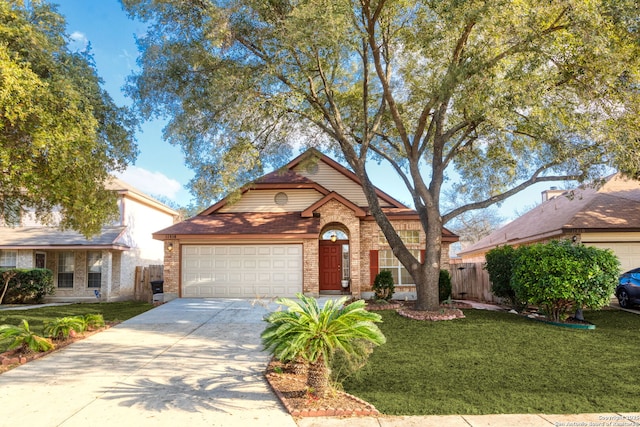 view of front of property with a garage and a front lawn