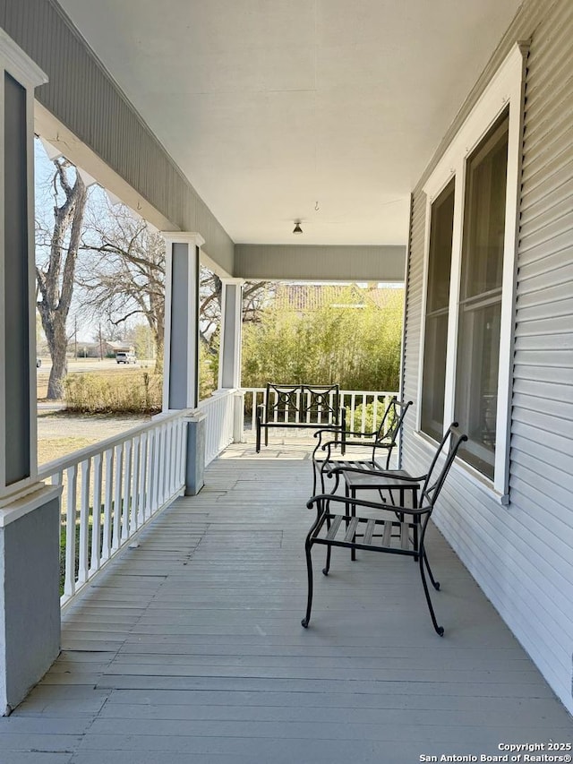 wooden terrace featuring a porch