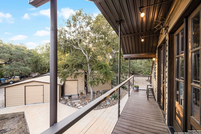 wooden deck featuring a shed