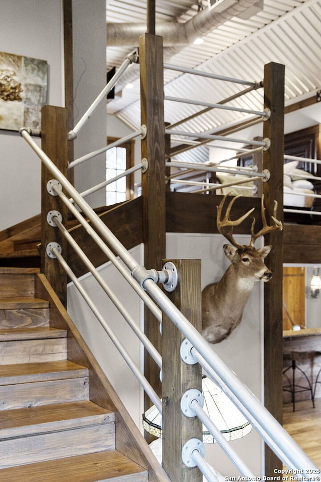 stairs with hardwood / wood-style floors