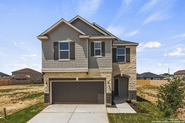 craftsman-style home featuring a garage