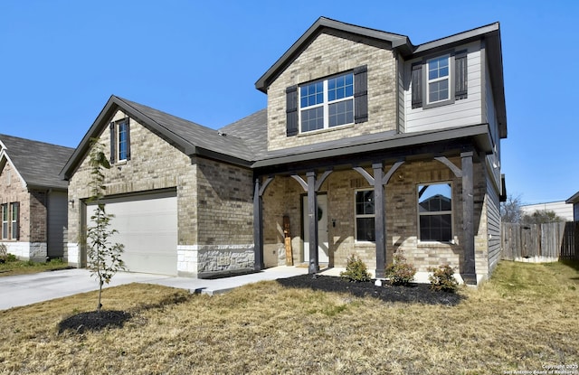 view of front facade featuring a garage, covered porch, and a front yard