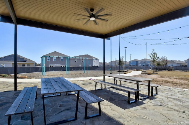 view of patio / terrace featuring ceiling fan and a playground