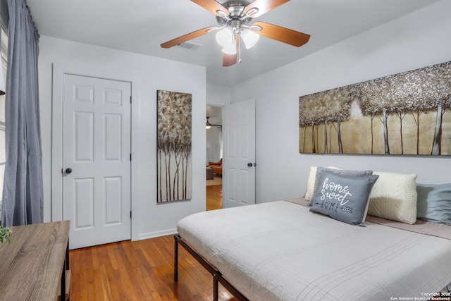 bedroom featuring ceiling fan and wood-type flooring