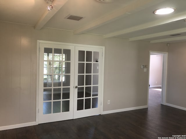 doorway with beamed ceiling, dark hardwood / wood-style flooring, and french doors