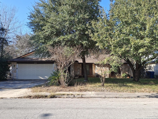 obstructed view of property featuring a garage