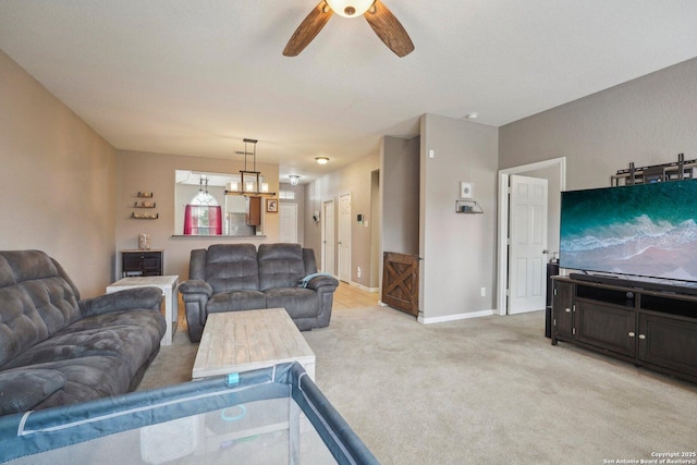 carpeted living room featuring ceiling fan