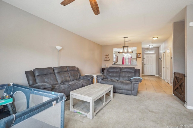 living room featuring tile patterned flooring and ceiling fan