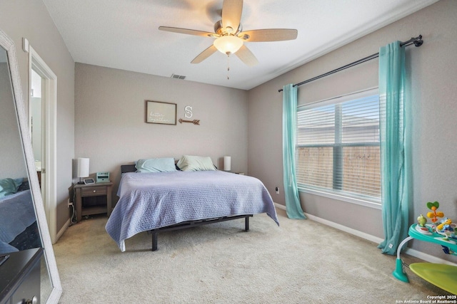 carpeted bedroom featuring ceiling fan