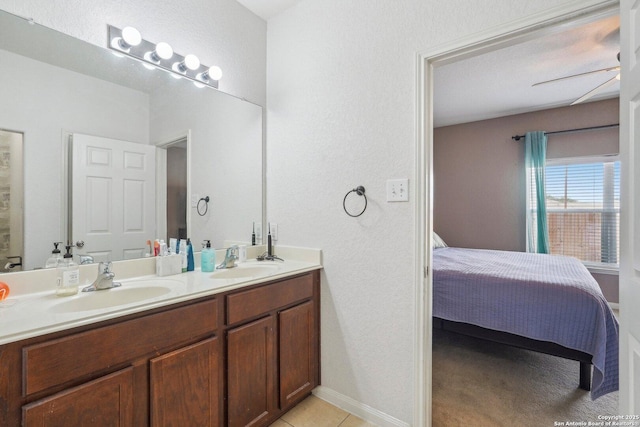 bathroom featuring vanity, tile patterned flooring, and ceiling fan