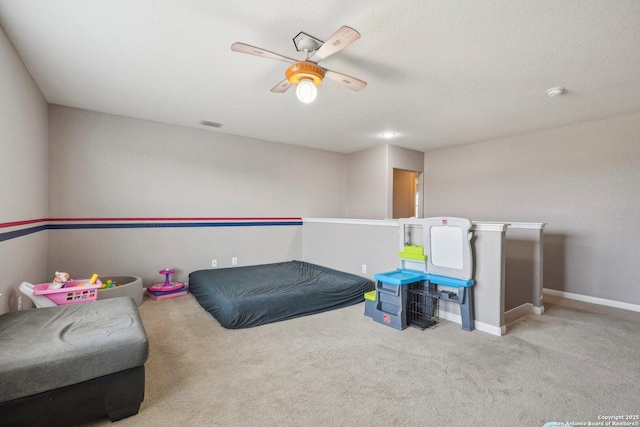 rec room with light carpet and ceiling fan