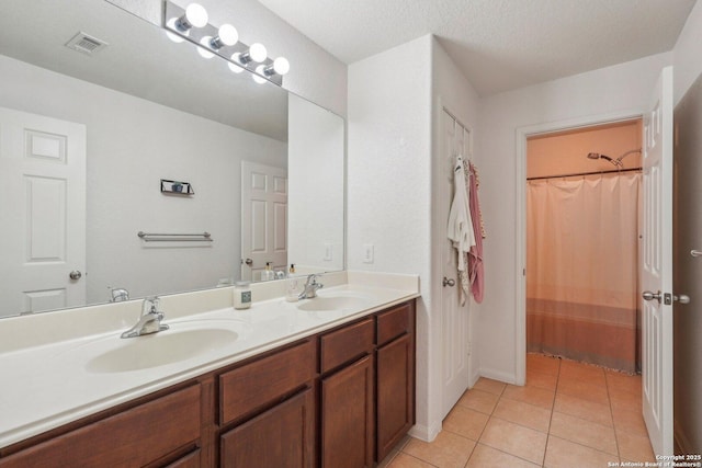 bathroom featuring vanity and tile patterned flooring