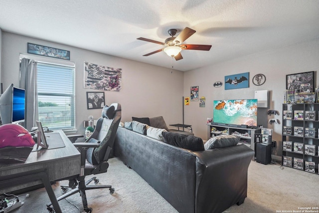 interior space with ceiling fan, carpet flooring, and a textured ceiling