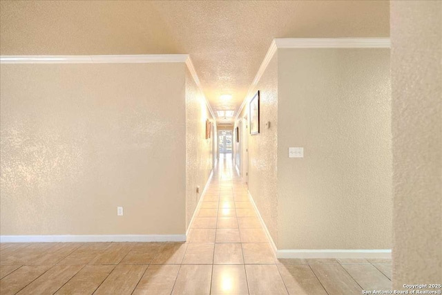 hall featuring crown molding and a textured ceiling