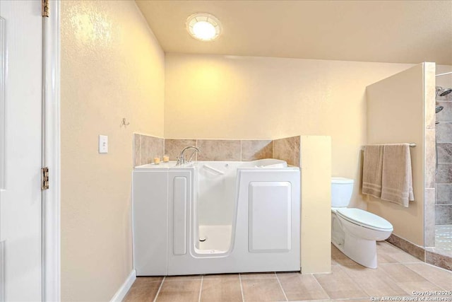 bathroom with tile patterned floors and toilet