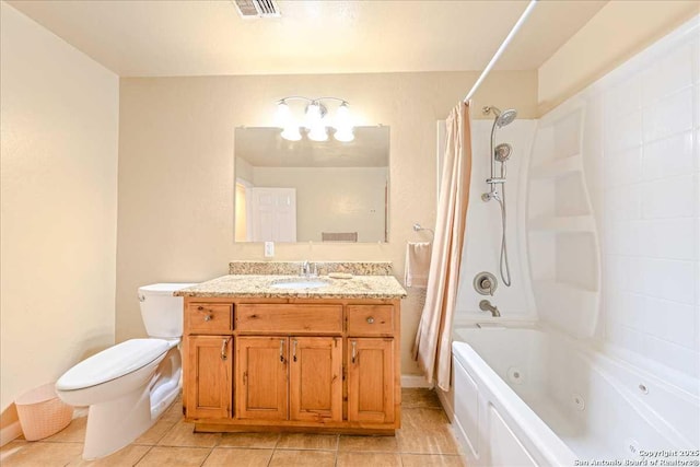 full bathroom with tile patterned floors, vanity, toilet, and shower / tub combo