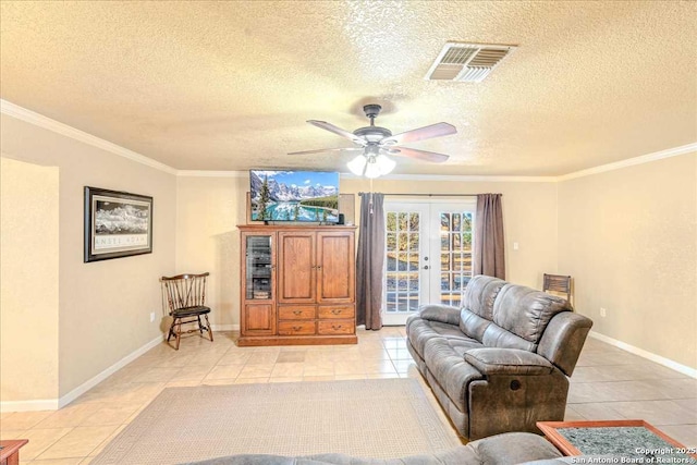 living room featuring crown molding, french doors, a textured ceiling, and light tile patterned flooring