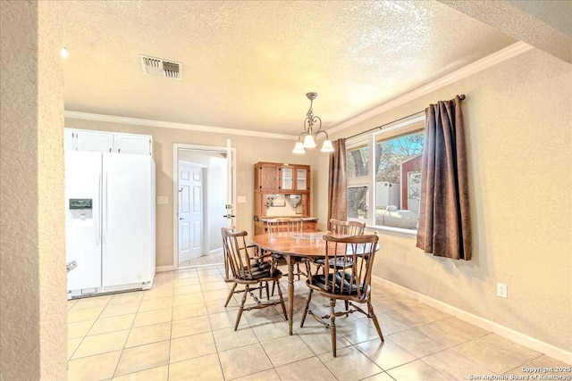 dining area featuring light tile patterned floors, a notable chandelier, ornamental molding, and a textured ceiling