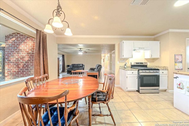 dining space featuring light tile patterned flooring, ceiling fan, and ornamental molding