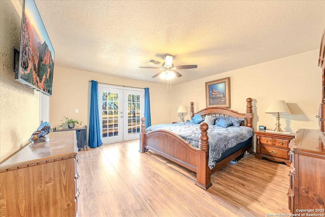 bedroom with french doors, access to outside, ceiling fan, and light hardwood / wood-style flooring