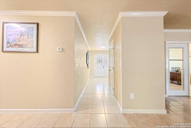 corridor with crown molding and light tile patterned floors