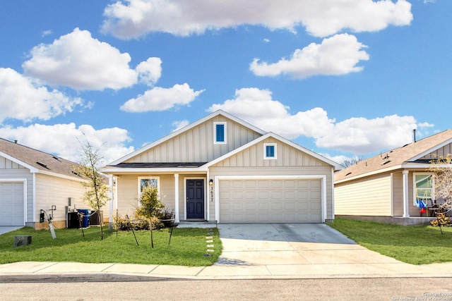 view of front of home with a garage, central AC unit, and a front lawn