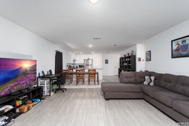 living room featuring light hardwood / wood-style flooring