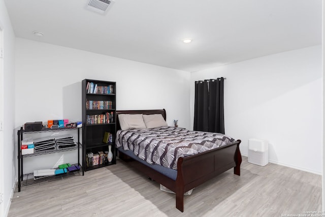 bedroom with light hardwood / wood-style floors