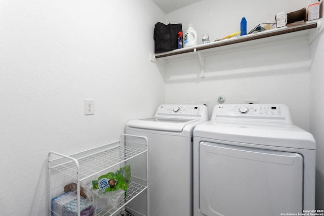 washroom with independent washer and dryer