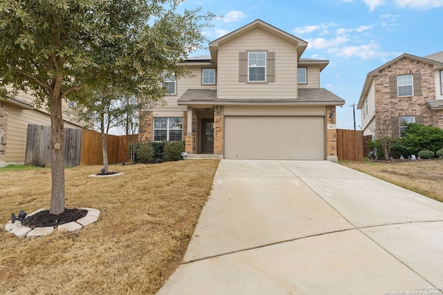 view of front property with a garage and a front yard